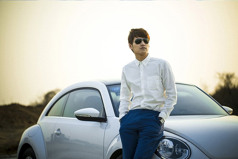 Outdoor portrait beside a car